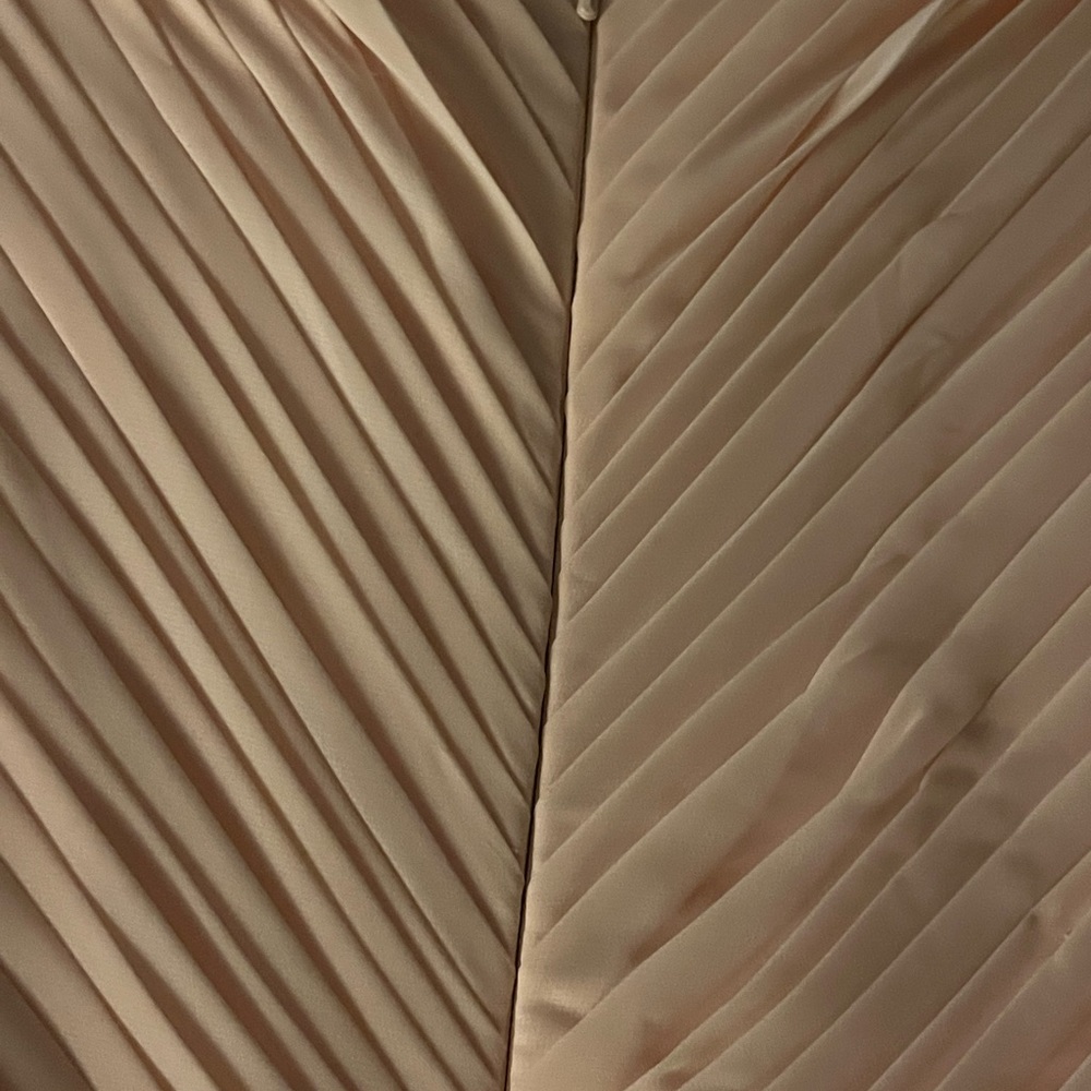 Long mother of bride dress the color is coral with full length zipper.